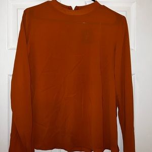 Brownish long sleeve blouse in size medium.